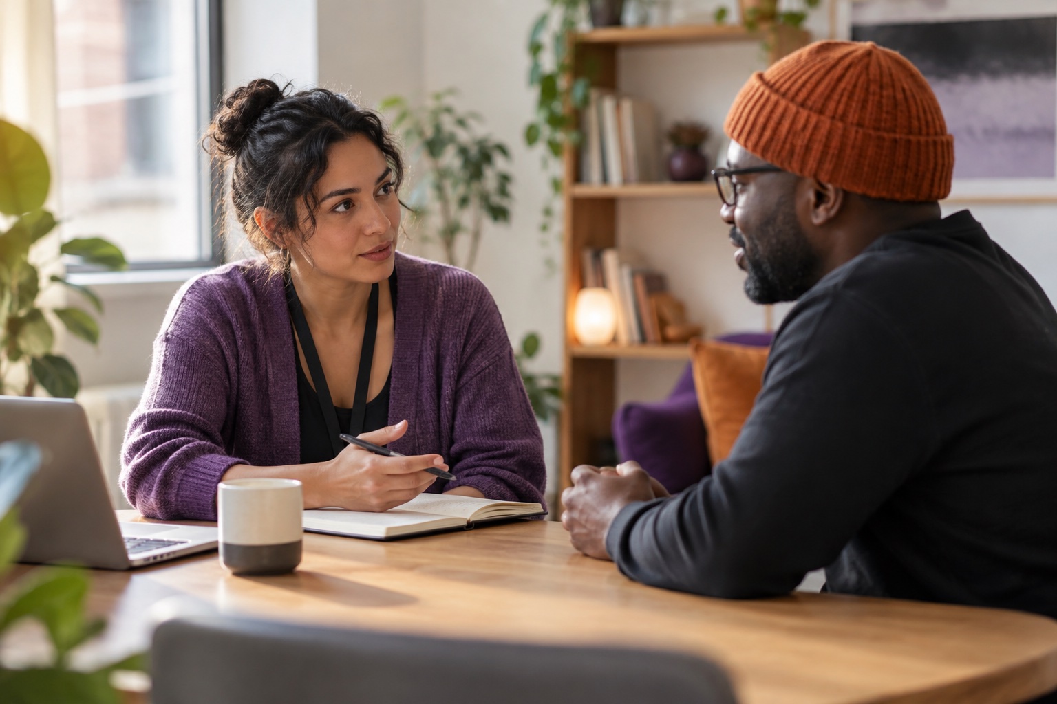 A researcher has a thoughtful conversation with an adult participant.